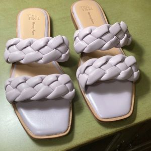 PURPLE SLIP ON SHOES. Size 8. It has woven straps.